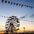 Ferris Wheel Silhouette against Orange Blue Sunset Sky in a Summer Night Royalty Free Stock Photo