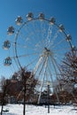 Ferris wheel, in a snow-covered, winter, city park. Royalty Free Stock Photo