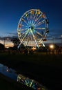 Ferris Wheel at twilight reflected