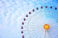 Ferris wheel under the cloudy sky.