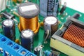 Ferrite choke and electrolytic capacitors mounted on the circuit Board Royalty Free Stock Photo