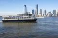 Ferry with background of Jersey City, USA