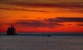 Ferry at beautiful crimson sunset in the Atlantic ocean near South Georgia, Antarctica