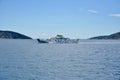 Ferry boat in Adriatic Sea with scenic blue sky and white clouds, near island Cres