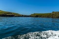 A ferry boat approaches the landing slip on Skomer Island breeding ground for Atlantic Puffins Royalty Free Stock Photo