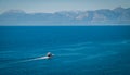 Ferry boat on blue sea and mountain background - Beautiful Turkey landscape travel landmark Royalty Free Stock Photo
