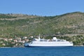 Ferry boat floating near croatian coastline in the Dalmatian riviera. Royalty Free Stock Photo