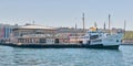 Ferry boat at Kadikoy Ferry Terminal getting ready for sailing after passengers loading at midday, Istanbul, Turkey