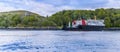 A Ferry boat passes Dunollie Castle near to Oban, Scotland