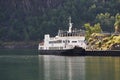 Ferry boat by the pier in the beautiful Norwegian fjord. Royalty Free Stock Photo