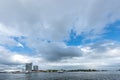 Ferry boat at the river Amstel and the IJ in Amsterdam with a cloudy blue sky as the background with a lot of empty space or