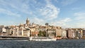 Ferry boat sailing in Bosphorus, with background of Galata Bridge and Galata Tower, Istanbul, Turkey Royalty Free Stock Photo