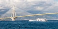 Ferry boat sailing under suspension bridge Royalty Free Stock Photo