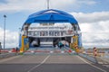 Ferry Boat Ship with open Ramp and empty Car Deck ready to board cars and passengers.