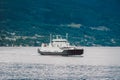 Ferry boat transportation Norway. White passenger ferry goes on fjord. In Norway. ferry crossing a fjord. Ferryboat cruising on