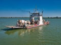 A ferry carrying three cement lorries crosses the Mekong River between Koh Dach / Silk Island and Phnom Penh