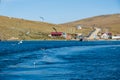 Ferry dock on the island of Olkhon with seagulls. Baikal Lake in autumn. Strait Olkhonskie Vorota and regular passenger