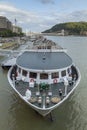 Ferry docked on the wide Danube river, Budapest Royalty Free Stock Photo