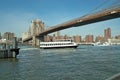 Ferry under the Brooklyn Bridge, New York, USA Royalty Free Stock Photo