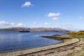 Ferry leaving craignure port in mull at the end of the day