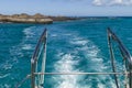 Ferry leaving a remote tropical island. Royalty Free Stock Photo