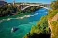 Ferry Maid of the Mist and Rainbow Bridge. Niagara Falls. Royalty Free Stock Photo