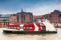 Ferry navigating on the Elbe river in a cold cloudy winter day Royalty Free Stock Photo