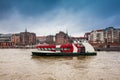 Ferry navigating on the Elbe river in a cold cloudy winter day Royalty Free Stock Photo