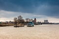 Ferry navigating on the Elbe river in a cold cloudy winter day Royalty Free Stock Photo