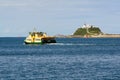 A ferry and the Nobbys Lighthouse - Newcastle