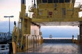 A ferry in port and another one sailing