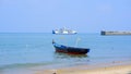A Ferry Passenger Ship And Fishing Boats On The Beach