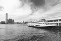 Ferry pier and skyline in Victoria harbor in Hong Kong city Royalty Free Stock Photo