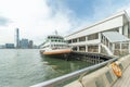 Ferry and pier in Victoria harbor in Hong Kong city Royalty Free Stock Photo