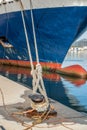 Ferry rope tied to metal boat slip at dock Royalty Free Stock Photo