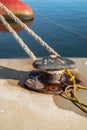 Ferry rope tied to metal boat slip at dock Royalty Free Stock Photo