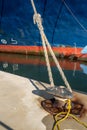 Ferry rope tied to metal boat slip at dock Royalty Free Stock Photo