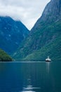 Ferry sailing in the Naeroyfjord in Gudvangen,  Norway Royalty Free Stock Photo