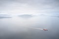 Ferry ship crossing on open vast ocean cruise journey aerial view from above during atmospheric weather sea island trip Scotland U