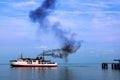 Ferry and smoke from the engine.