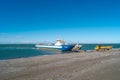 Ferry is taking cargo with cars and touristic buses at Punta Delgada through Strait of Magellan, Tierra del Fuego, Patagonia, Royalty Free Stock Photo