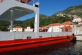 The ferry transports tourists and cars across the Bay of Kotor. Montenegro