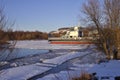 Ferry at the winter parking lot during the spring flood, the rivers that open up from the ice. Background