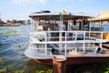 Ferryboat anchored at harbor waiting to transport passengers across river. Marine Transportation, Commercial Vessel, Ferry Trip, T