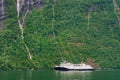 Ferryboat on the Geirangerfjord with mountains in Norway