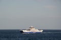 Blue and white colored ferry boat, cruising and calm blue water, beautiful blue sky. Mediterranean holiday concept, ferryboat