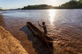 Ferryman on wooden coarse boat on mystical Omo river, Ethiopia