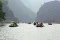 Ferrymen are taking tourists to visit the Trang An Eco-Tourism Complex, a complex beauty - landscapes called as an outdoor Royalty Free Stock Photo