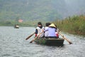 Ferrymen are taking tourists to visit the Trang An Eco-Tourism Complex, a complex beauty - landscapes called as an outdoor Royalty Free Stock Photo