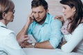 Doctor with man and women together in therapy consult session of inability to get pregnant Royalty Free Stock Photo